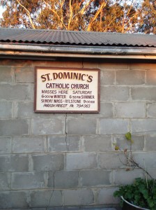 The old Church sign, found in the garage and now housed outside.