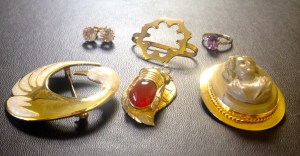 An exquisite cameo brooch makes an appearance with other interesting accessories.