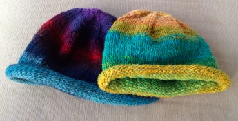 The Roll Brim Beanies in Noro are one of our popular sellers with both adults and kids.